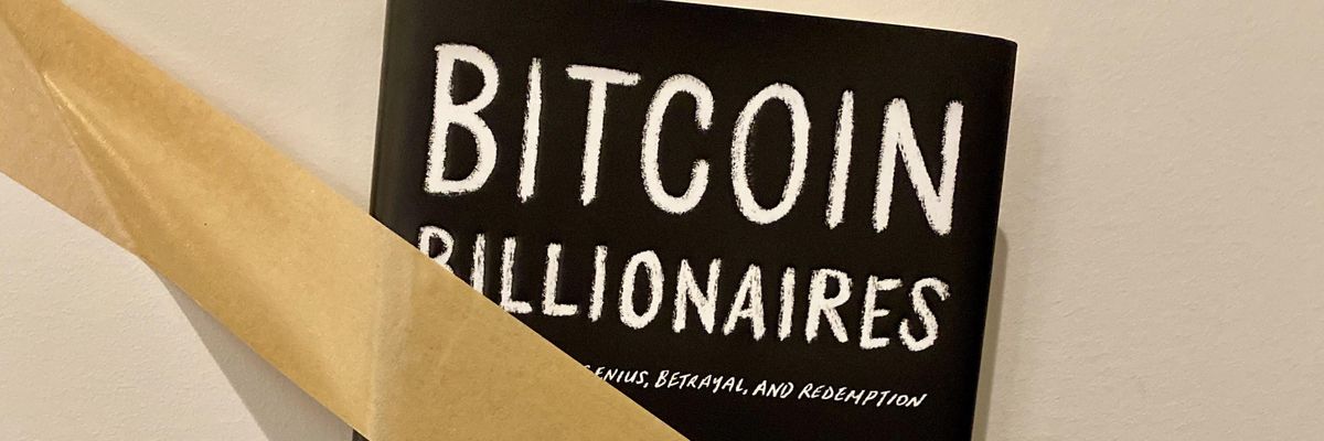 Ben Mezrich's book Bitcoin Billionaires taped to the wall