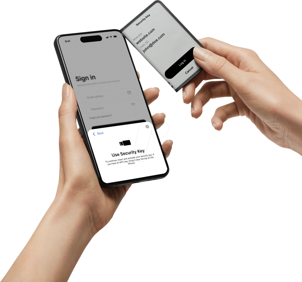 Image of user holding a mobile phone and using Ledger Stax as FIDO U2F security key