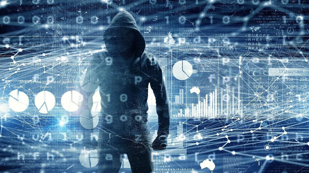 Hacker superimposed on digital charts