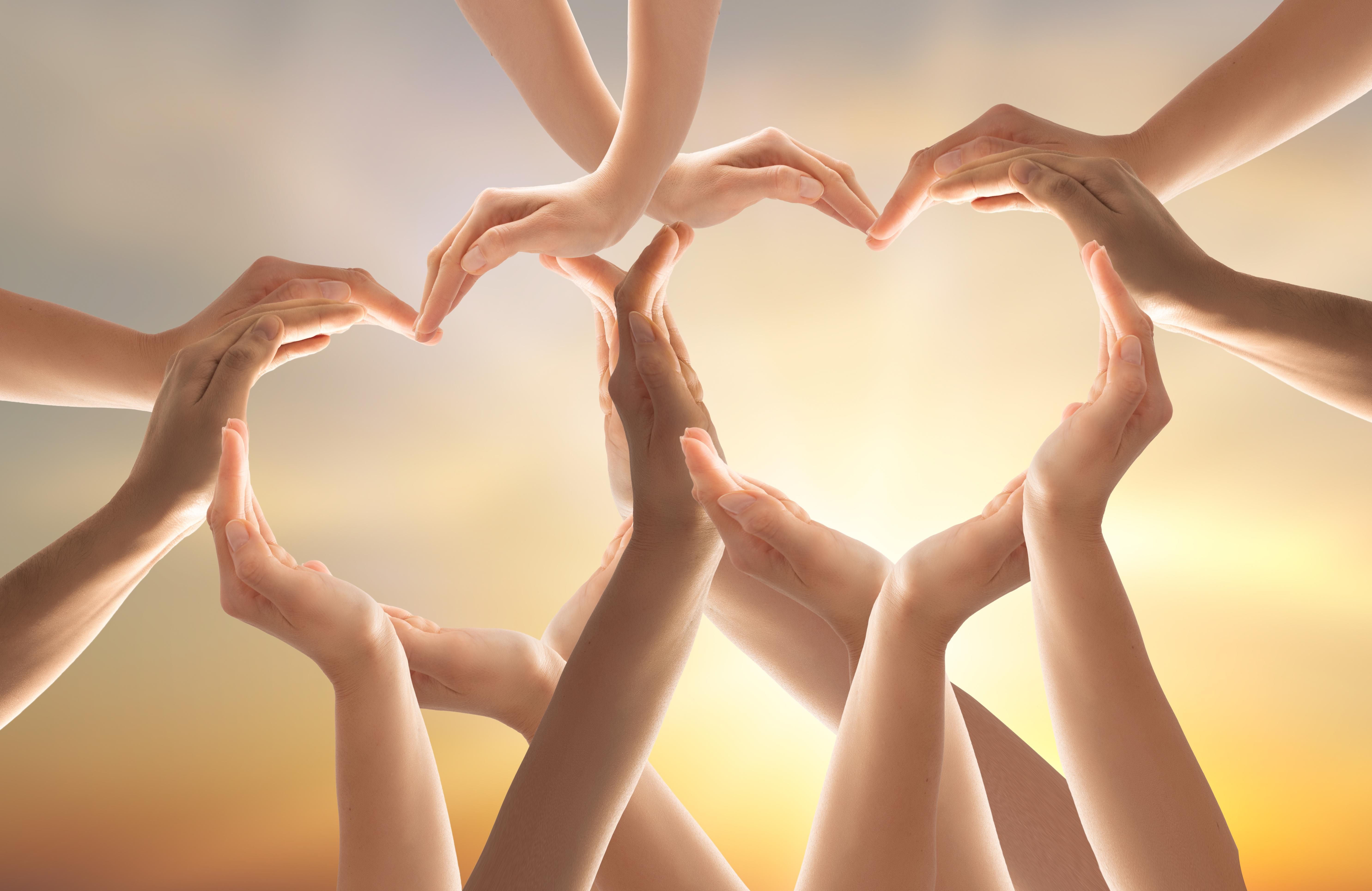 Two hearts made up of interlocking hands