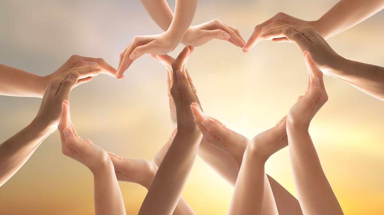 Two hearts made up of interlocking hands