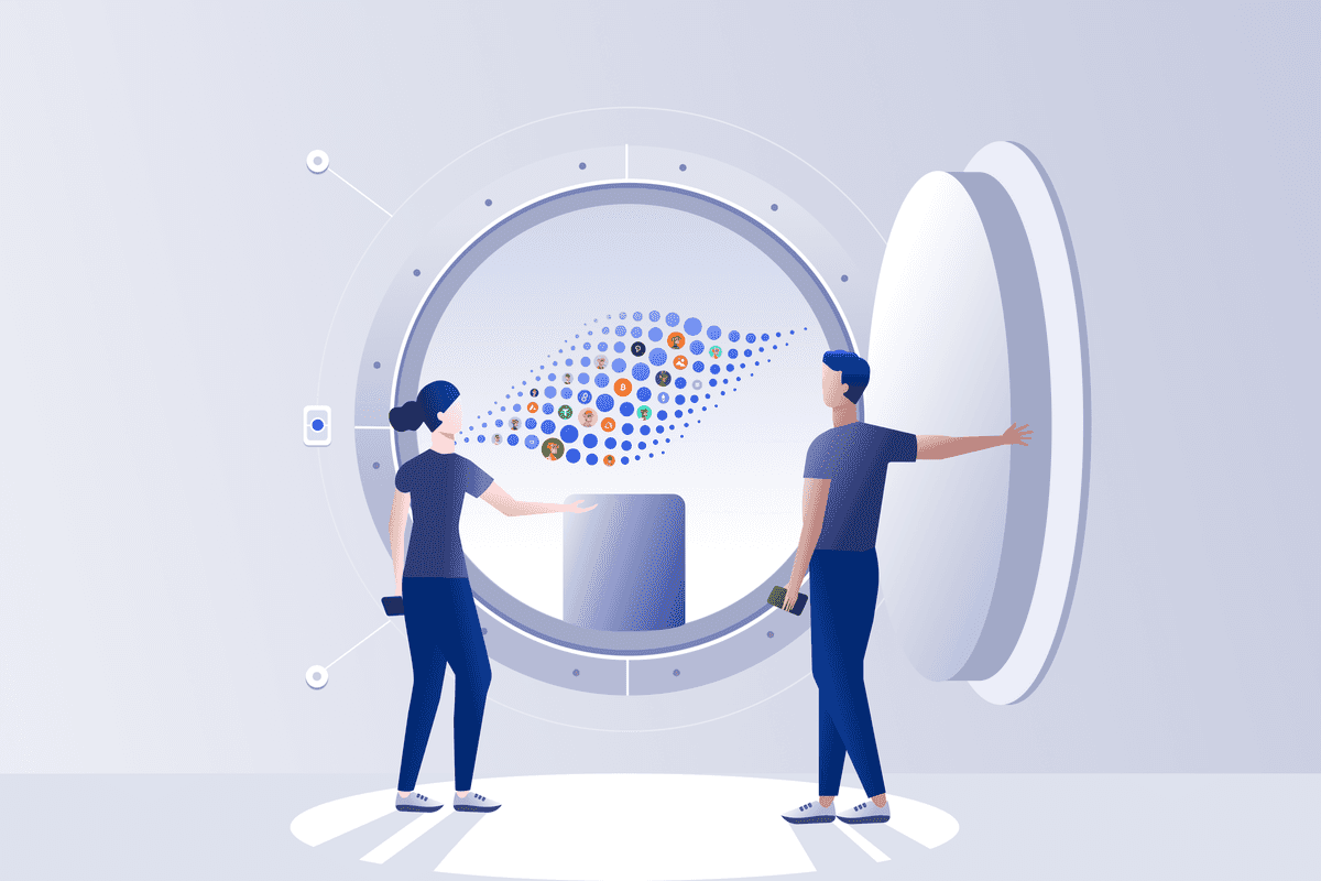 Two people opening a large Vault with digital assets